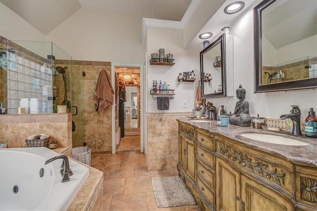 bathroom featuring vanity, plus walk in shower, vaulted ceiling, and tile walls