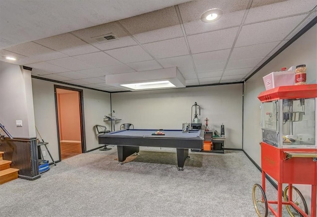 playroom with carpet and a paneled ceiling