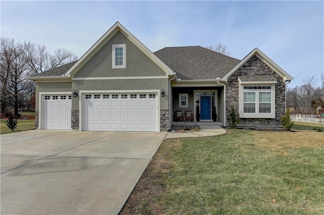 view of front facade featuring a garage and a front yard