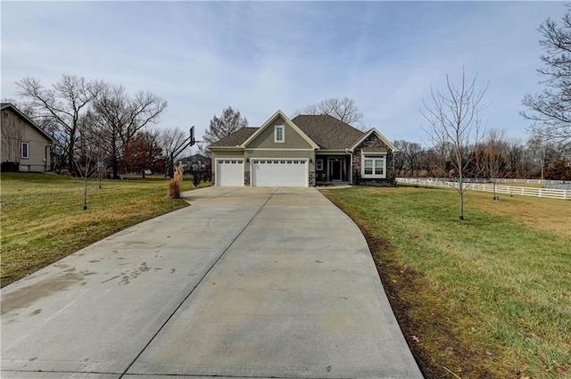 view of front of home featuring a garage and a front lawn