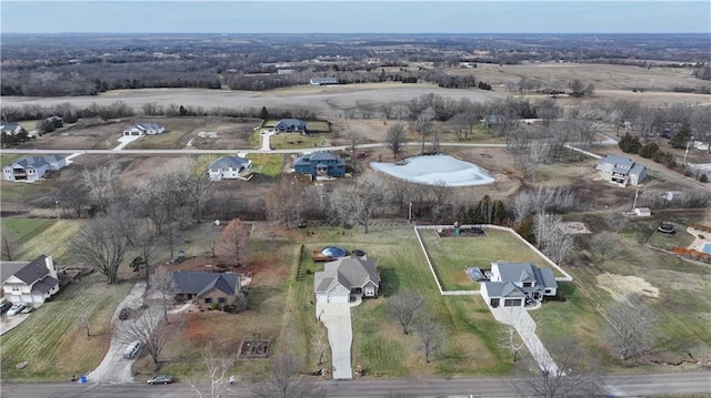 birds eye view of property with a rural view