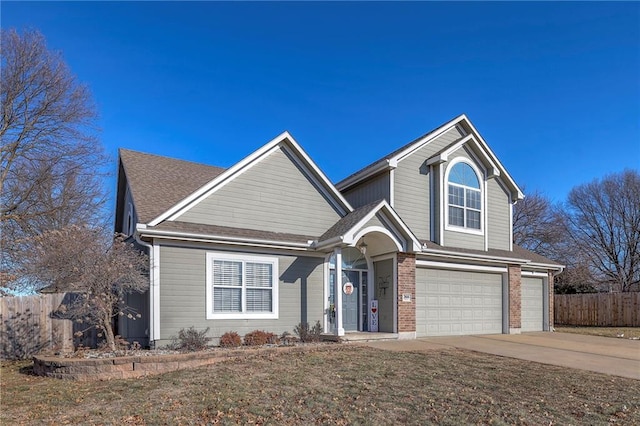 view of front of house with a garage and a front yard