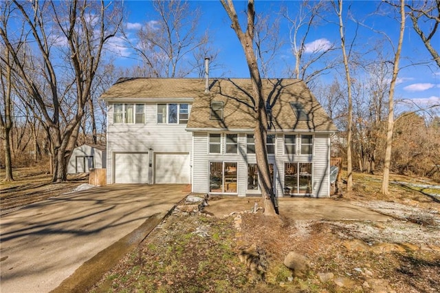 view of front of home featuring a garage and concrete driveway