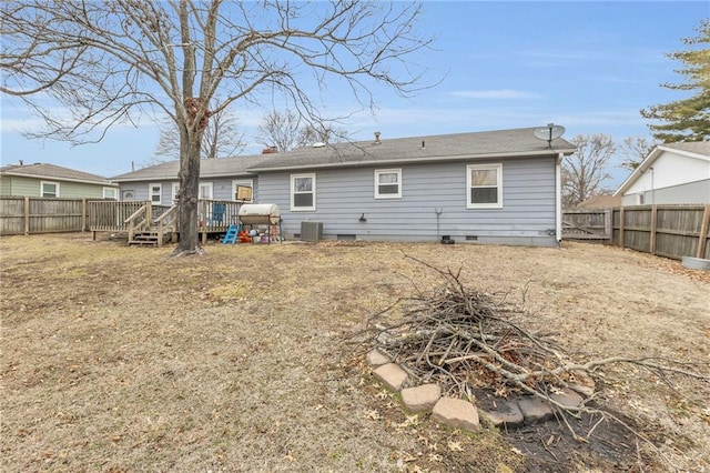 rear view of house with a deck and central air condition unit