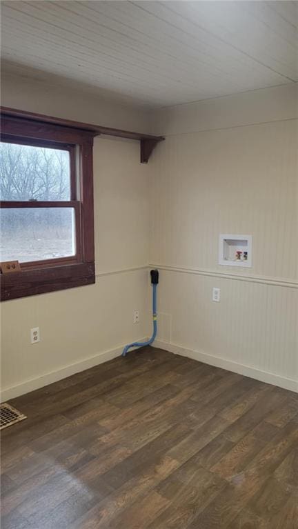 spare room featuring dark hardwood / wood-style flooring