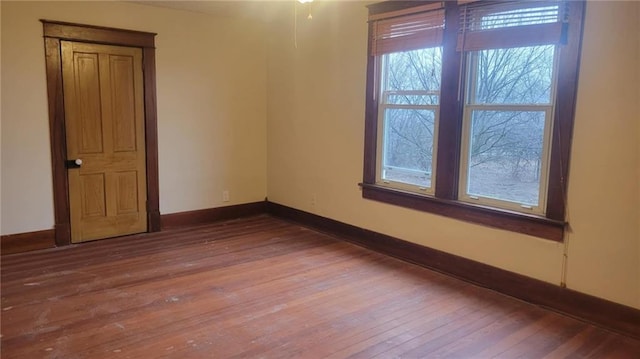 spare room with hardwood / wood-style flooring