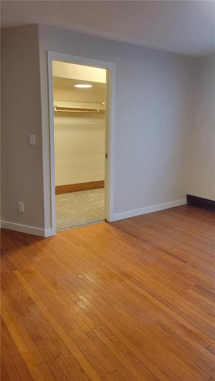 spare room with light wood-type flooring