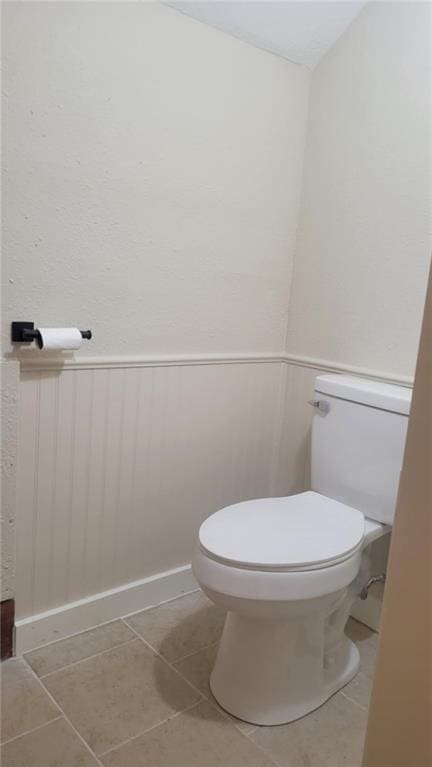 bathroom with tile patterned floors and toilet