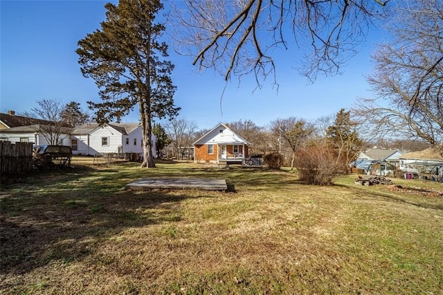 view of yard featuring fence and a wooden deck