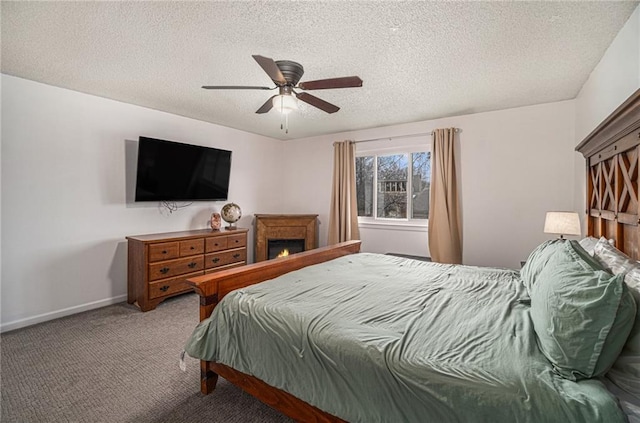 carpeted bedroom with a textured ceiling and ceiling fan