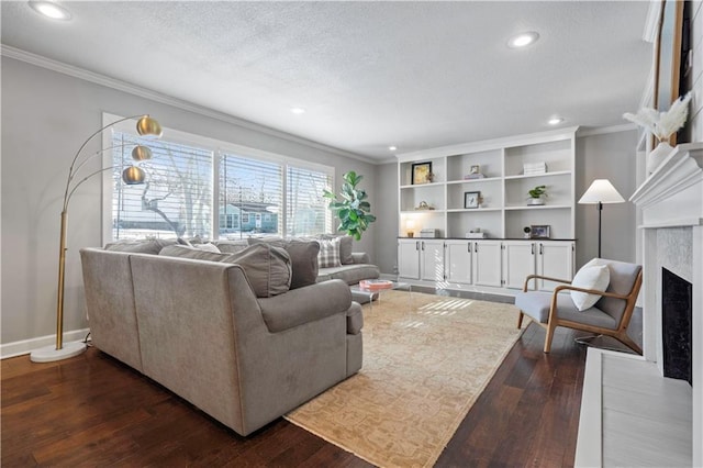 living area featuring baseboards, a textured ceiling, ornamental molding, and dark wood-style flooring