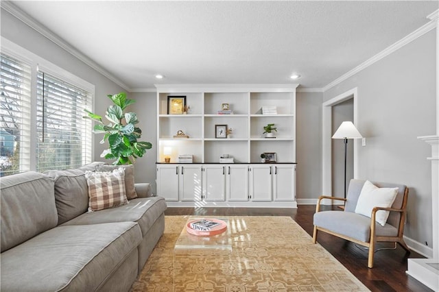 living area featuring crown molding, dark wood-type flooring, baseboards, recessed lighting, and a textured ceiling