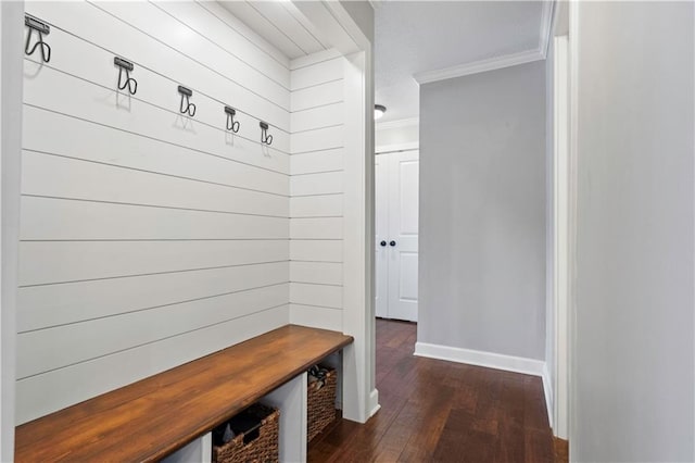 mudroom featuring baseboards, ornamental molding, and dark wood-style flooring