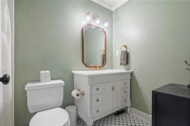 full bath featuring vanity, crown molding, toilet, and baseboards