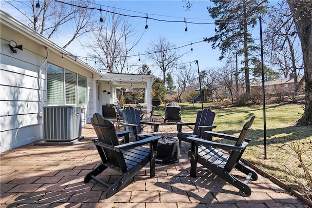 view of patio / terrace featuring central air condition unit and a playground