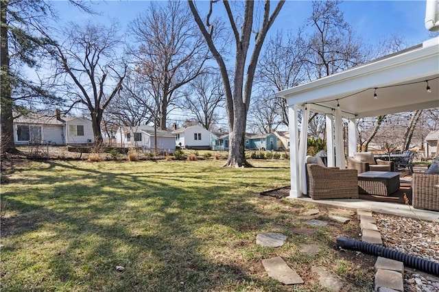 view of yard with an outdoor hangout area, a residential view, and a patio area