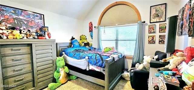 carpeted bedroom with lofted ceiling