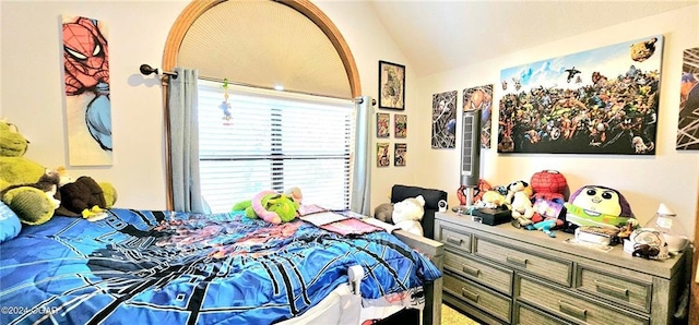 bedroom featuring vaulted ceiling