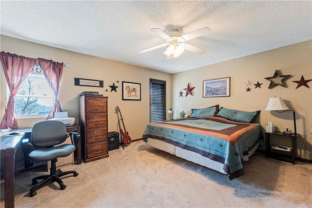 carpeted bedroom with a textured ceiling and ceiling fan