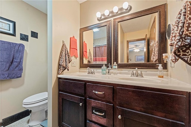 bathroom featuring vanity and toilet