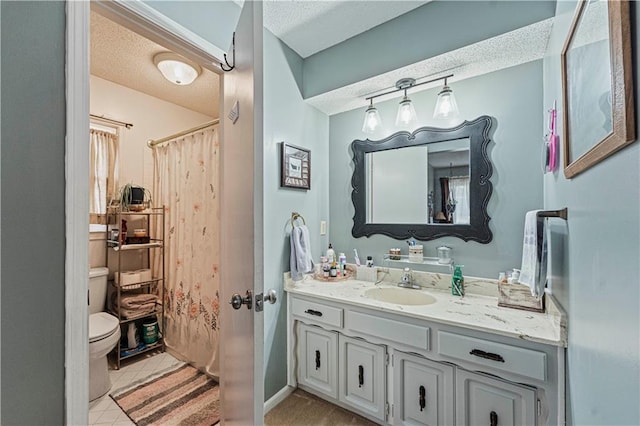 bathroom featuring toilet, a shower with curtain, a textured ceiling, vanity, and tile patterned flooring