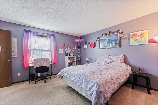 carpeted bedroom with a textured ceiling