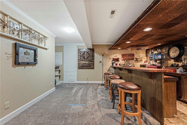 bar with ornamental molding and carpet