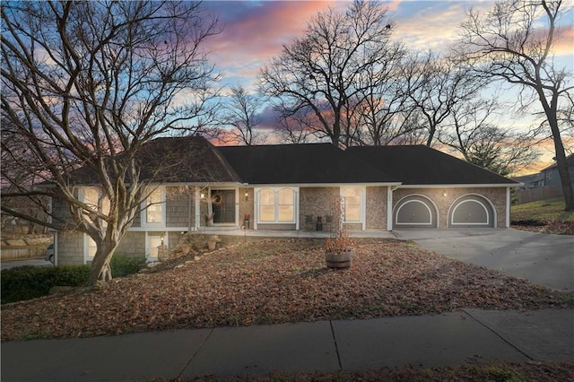 ranch-style house featuring a garage