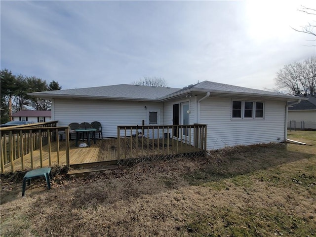 back of property featuring a deck