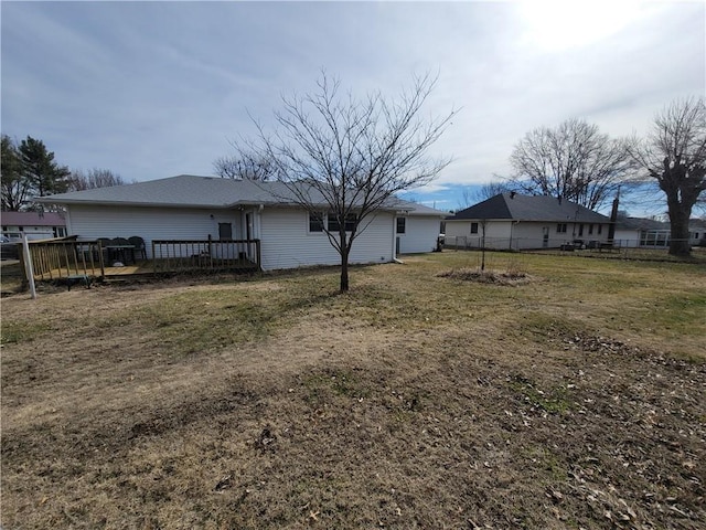 exterior space featuring a wooden deck and a yard