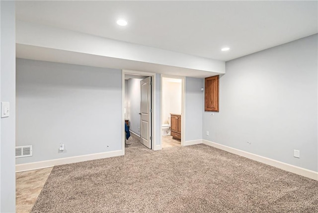 basement with light carpet