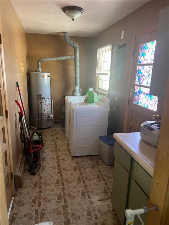 laundry area featuring separate washer and dryer, gas water heater, electric panel, and cabinets