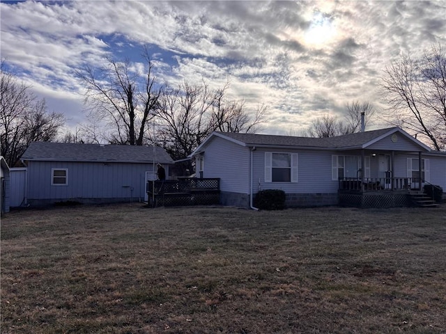 exterior space featuring a yard and covered porch