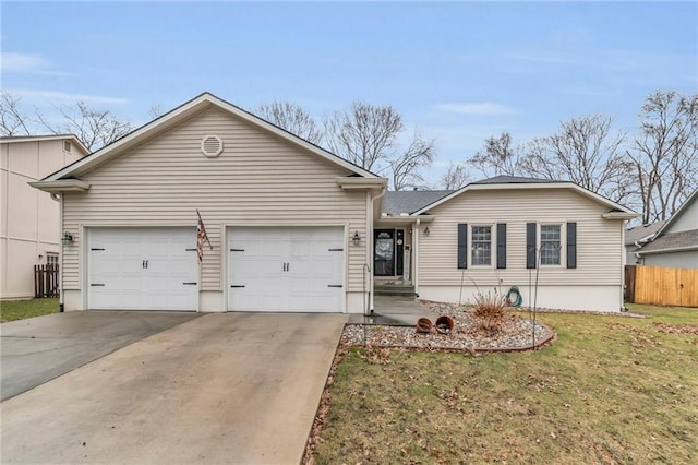 single story home with concrete driveway, an attached garage, fence, and a front yard