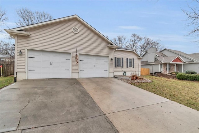 ranch-style house featuring a garage, driveway, a front yard, and fence