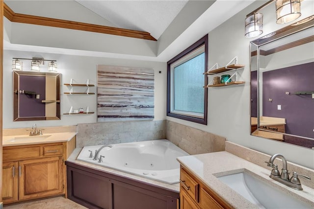 full bathroom with lofted ceiling, a jetted tub, two vanities, and a sink