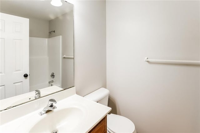 full bathroom with vanity, bathing tub / shower combination, and toilet