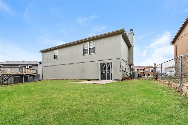 back of house featuring cooling unit and a yard