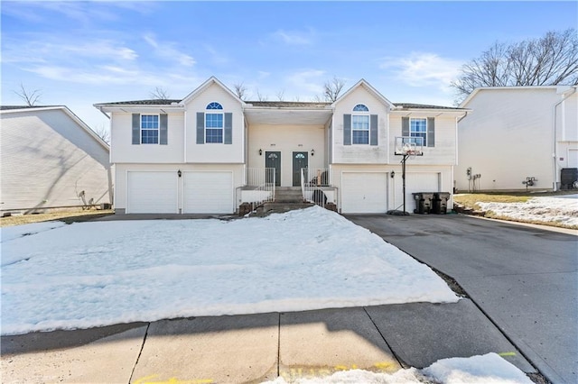 raised ranch featuring a garage