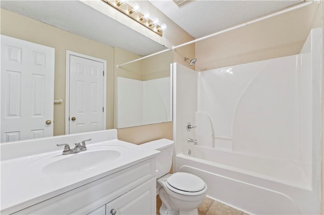 full bathroom featuring shower / bath combination, vanity, a textured ceiling, tile patterned floors, and toilet