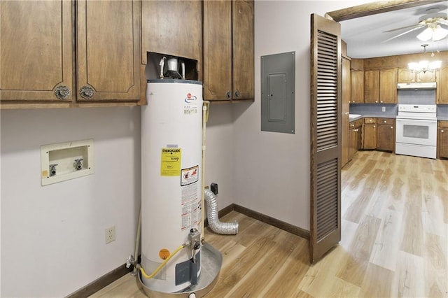 utility room with gas water heater and electric panel