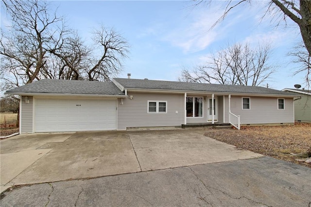 ranch-style house featuring a garage