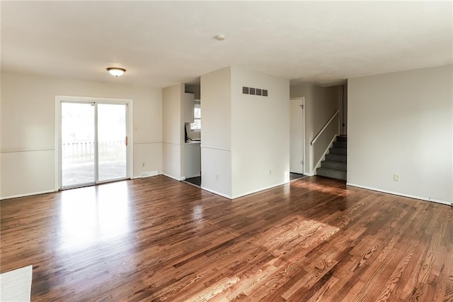 unfurnished living room featuring hardwood / wood-style flooring