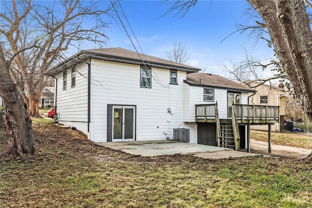 back of house with a patio area, a lawn, and a deck