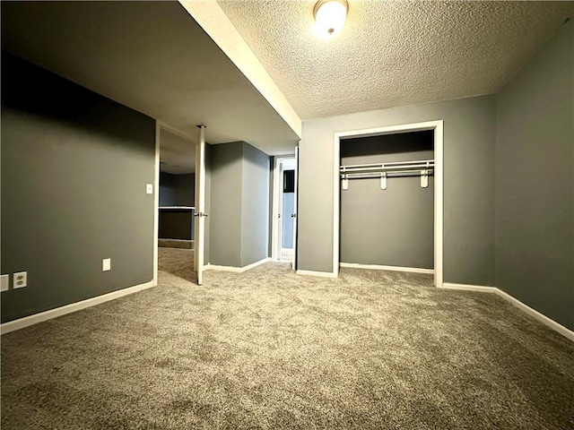 unfurnished bedroom featuring carpet floors, a closet, and a textured ceiling