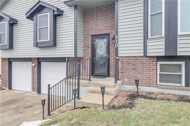 doorway to property featuring a garage