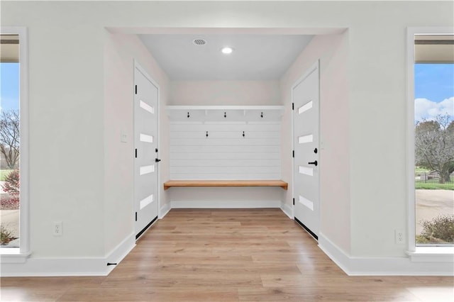 interior space featuring light wood-style floors, baseboards, and recessed lighting