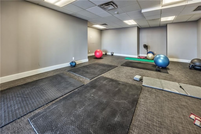 workout room with a drop ceiling