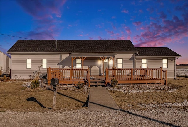 view of front of home featuring a wooden deck