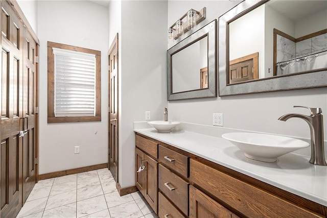 bathroom featuring vanity and curtained shower